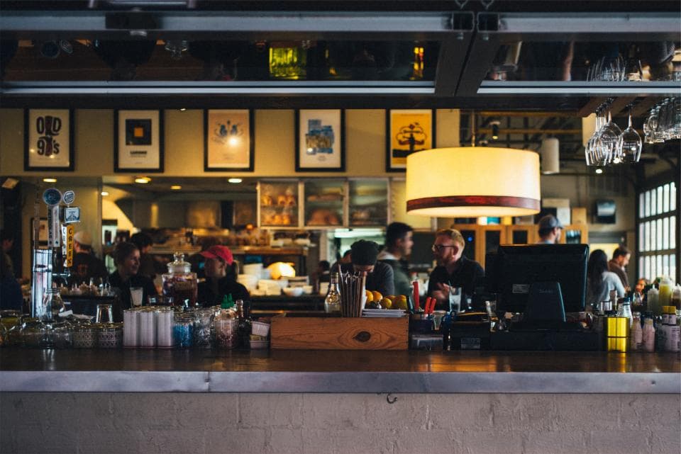 Busy restaurant and bar with warm lighting